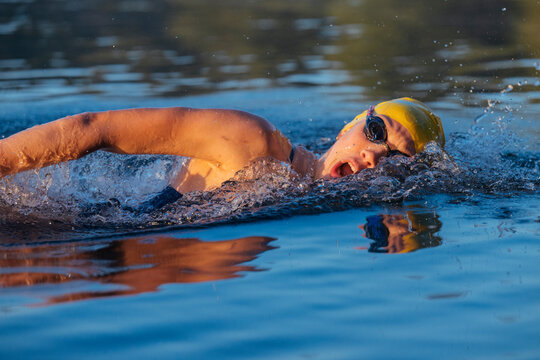 White swimmer doing freestyle stroke in open water