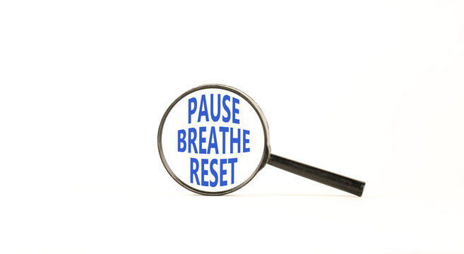 Pause breathe reset words symbol. Concept words Pause breathe reset in beautiful magnifying glass. Beautiful white background. Business support motivational and pause breathe reset concept. Copy space