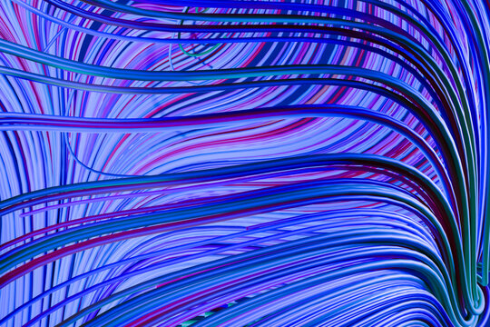 Abstract colorful flowing lines forming dynamic wave pattern