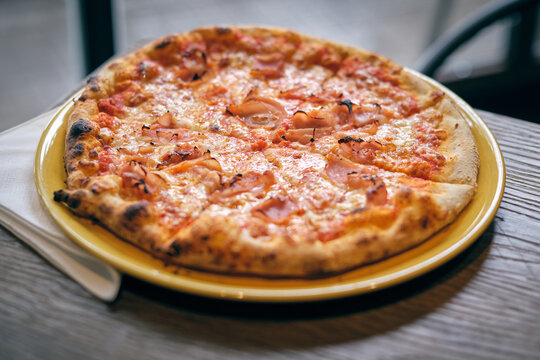 Freshly baked ham and cheese pizza lunch