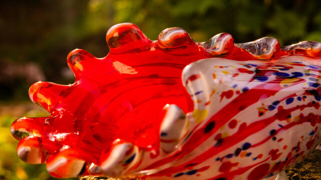 Retro souvenir made of red colored glass. Glass wave.