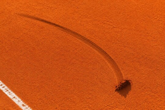 Clay court sliding mark left by a stopped foot