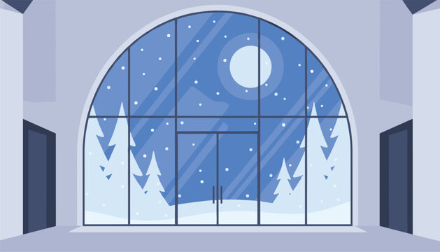 Large arched window provides a view of a snowy landscape with pine trees at night under the light of a full moon in the winter.