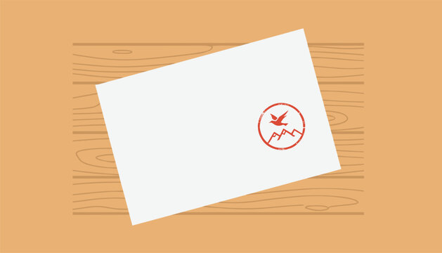 Closed white envelope with a red mountain and bird stamp on a light wooden surface representing traditional communication and mail.