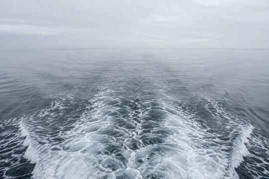 Boat wake fading to flat water astern