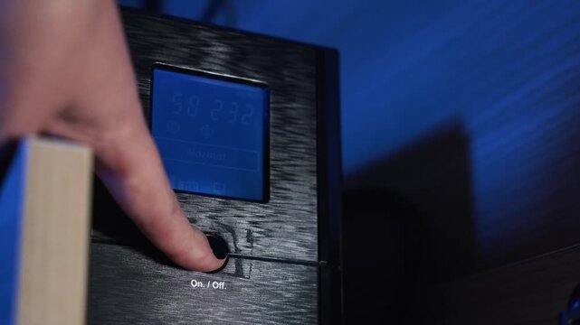 Computer UPS shutting down. Backup power for equipment. Screen displaying battery charge percentage. Concept of backup power supply and energy independence. Electricity, storage, blackout, battery.