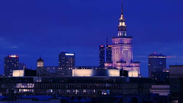 Warsaw Skyline At Night Featuring Illuminated Palace Of Culture And Science In Poland
