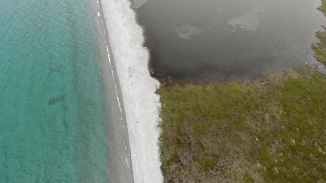 Lake Baikal coastal lagoons show stone barrier formation along a changing freshwater shoreline.