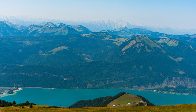 Aerial misty landscape. Scenic nature over lake. Misty mountain lake. Aerial view of mountain landscape. Landscape panorama. Misty landscape with mountain lake in nature. Mountain peak aerial view