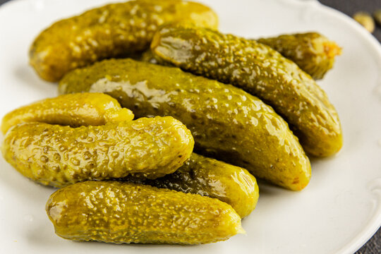 Gherkins pickled cucumbers vegetable appetizer healthy eating tasty snack fresh, gourmet, rustic food background on the table top view copy space