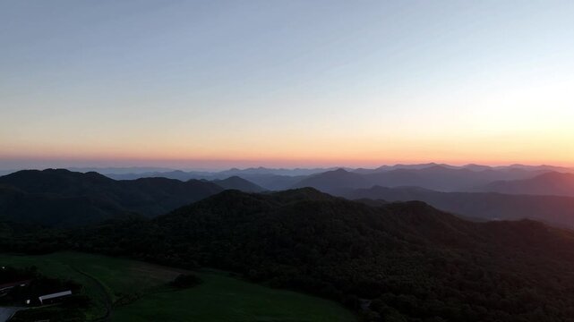Sunrise over Mount Sanbe in Shimane, Japan, with the mountain glowing in warm morning light