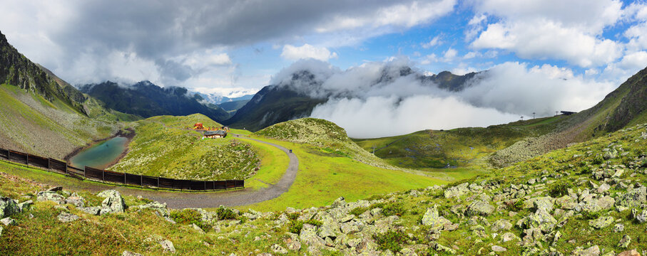 Landscape of Green mountain Alps near Small Alpine Village in Alps - K&uuml;htai, Austria