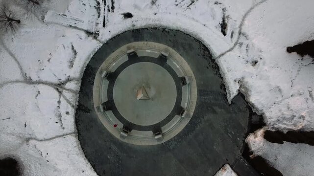 Top-down view of the stele against the snow