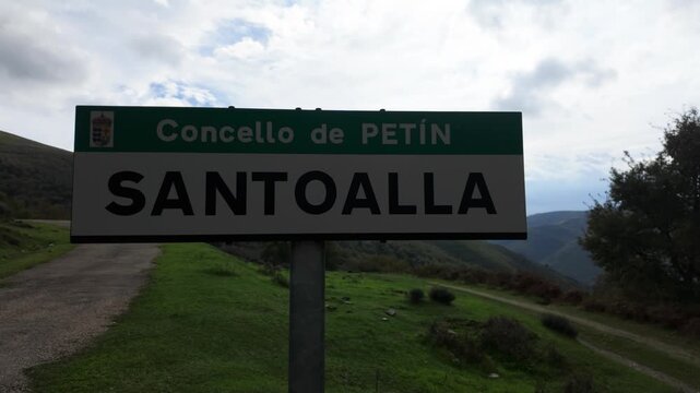 Roadside sign marking the entrance to Santoalla do Monte, a remote semi-abandoned village in Pet&iacute;n, Ourense, Galicia, Spain, reflecting rural isolation and depopulation