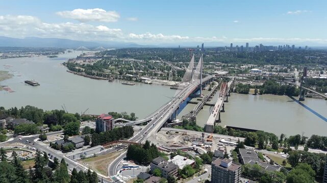 The new stal̕əw̓asəm Bridge stands beside the existing Pattullo Bridge over the Fraser River between New Westminster and Surrey, British Columbia, Canada, during the bridge replacement project