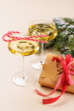 Champagne glasses and snowy fir branches