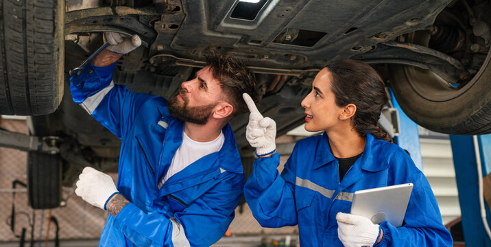Generated Team Auto mechanic are checking and repair maintenance auto engine is problems at car repair shop.