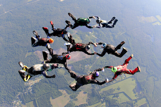 Skydivers make a formation teamwork