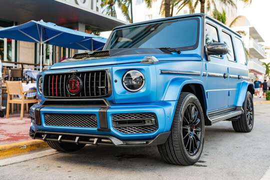 Miami, Florida, USA - July 27, 2025: Car Mercedes Benz AMG G 63 parked outdoor. Blue matte car, corner view. Mercedes-Benz G 63 luxury off road SUV 2022 car. SUV Mercedes Benz AMG G 63
