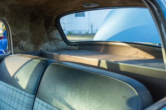 View of the old antique classic interior of an car showing back seat space