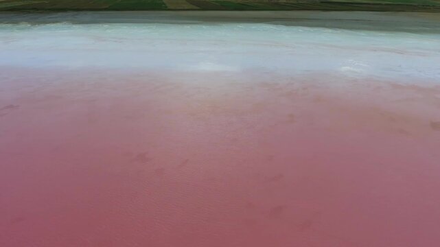 Pink Tuz Golu in Turkey shows mineral rich saline water and salt flats before sunset.