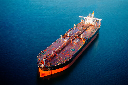 Oil tanker floating on ocean in a beach