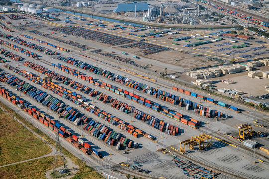 Container yard with freight containers and cargo equipment in a beach