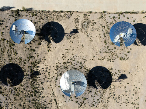 aerial view of parabolic dish solar power plant in desert
