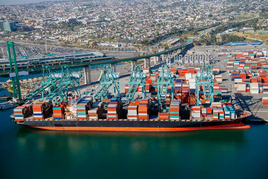 Container ship loaded with cargo containers in a beach