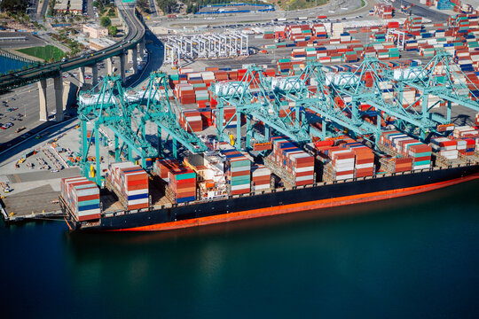 Container ship loaded with cargo containers in a beach