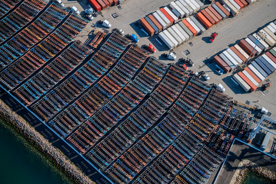 Container chassis and truck trailers parked at port parking lot