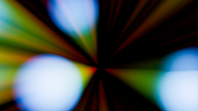 Abstract colorful light beams with glowing circles on dark background