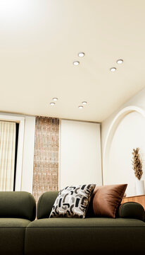 Green sofa with pillows in modern living room interior