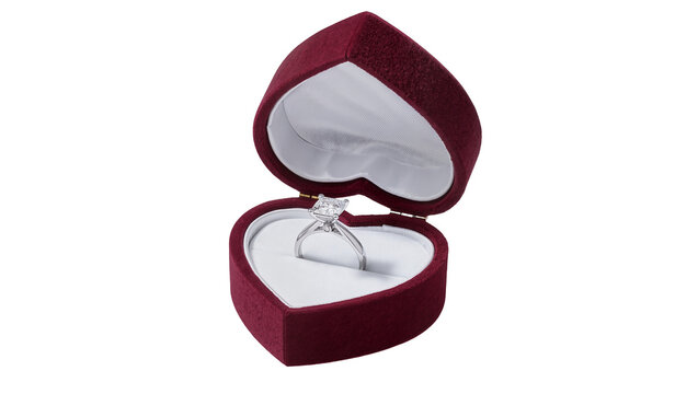 Maroon heart-shaped velvet ring box with diamond engagement ring, isolated on transparent background