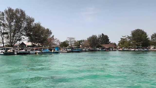View of clear shallow sea water near tropical island beach
