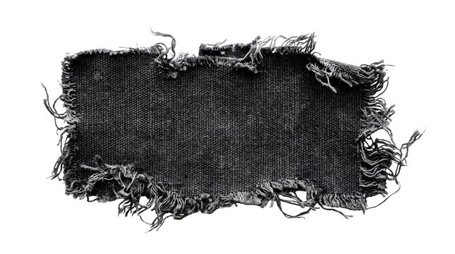 A torn black fabric swatch with frayed edges for the concept of grunge and texture.