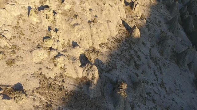 Aerial views sweep across Cappadocia fairy chimneys, valleys, and eroded tuff landscapes.