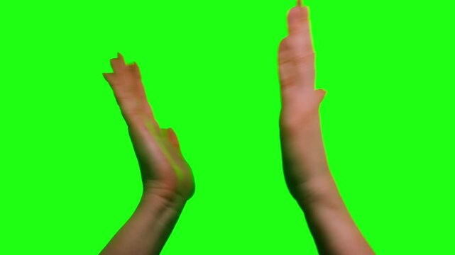 Two raised fists celebrating victory and success, then hands clapping with excitement and triumph. Emotional gesture of achievement on green screen background. High quality 4k footage