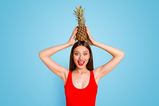 Emotion facial expressing leisure play people person concept. Close up photo portrait of funky stylish trendy beautiful lovely shocked lady with fresh tasty ananas on head isolated on vivid background