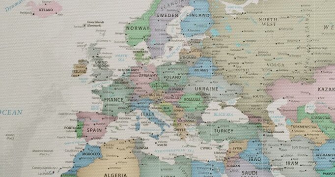 Slow camera movement over a detailed political map of Europe, showing national borders, countries, and major cities like Paris, Rome, and Berlin with a subtle, textured canvas background