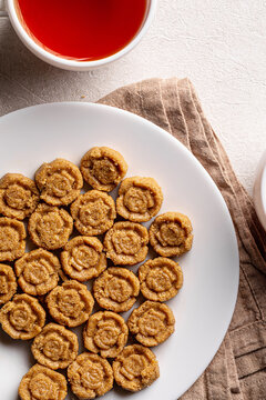 Traditional Kazakh national sweet dessert zhent made of crushed millet talkan served on white round plate