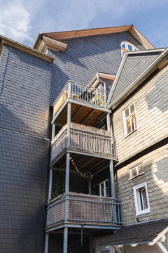 Traditional Slate-Clad Building with Stacked Balconies