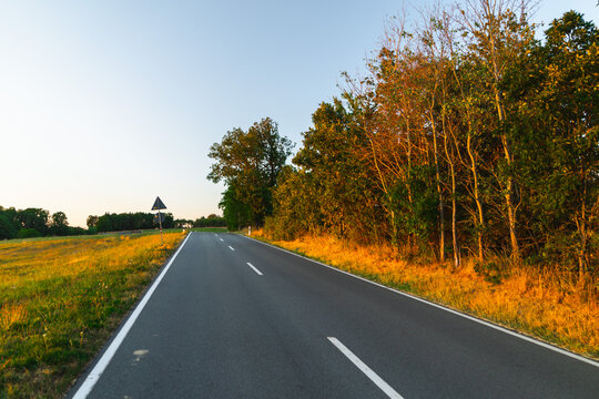 Empty Rural Road Through German Countryside at Golden Hour