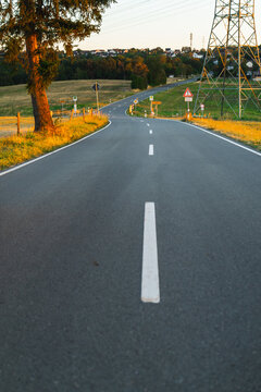 Winding Rural Road Through German Countryside at Golden Hour
