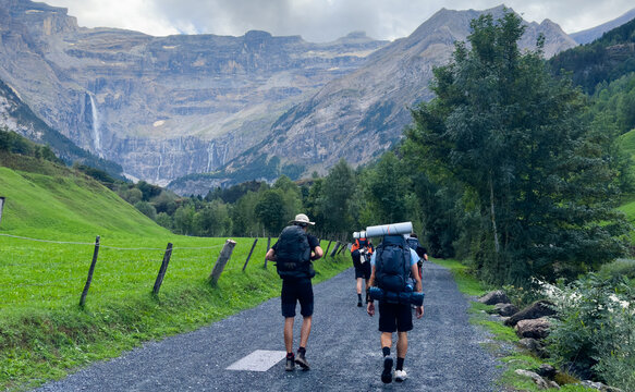 Hiking trail to Gavarnie Falls, spectacular waterfall in french Pyrenees, highest waterfalls in France, popular tourist landmark