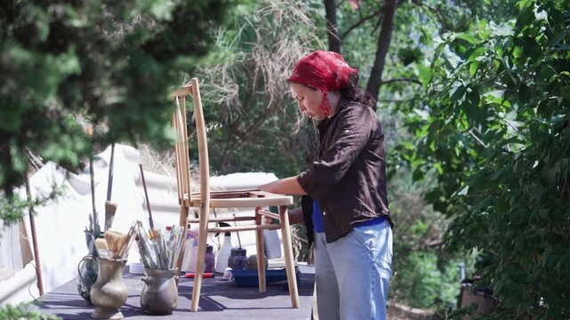Woman Painting Old Chair as a Slow Living Activity