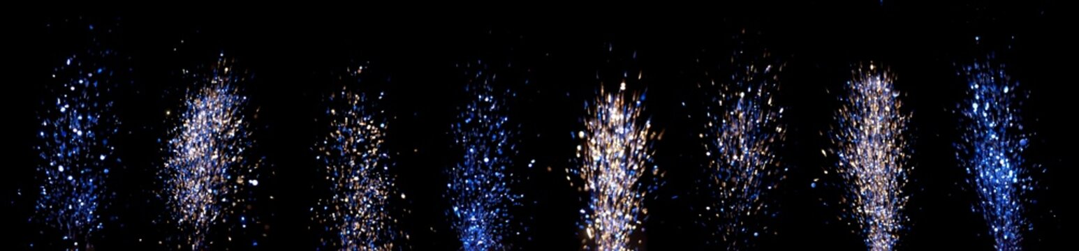 Colorful fireworks display lighting up the night sky in an outdoor celebration