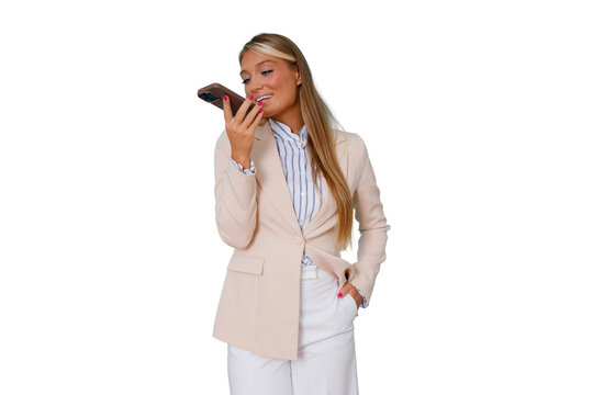 Businesswoman dictating audio message into a smartphone, standing on a transparent background, using mobile communication