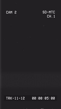 Retro VHS camera overlay with analog noise, timer, camcorder indicators on dark background. 4K animation with alpha channel.