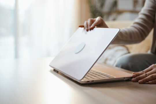 Open screen shows using freelance laptop hand typing motion, then shows using freelance laptop hand typing motion in a dim warm soft calm quiet bright sunlit natural gentle serene muted private room.